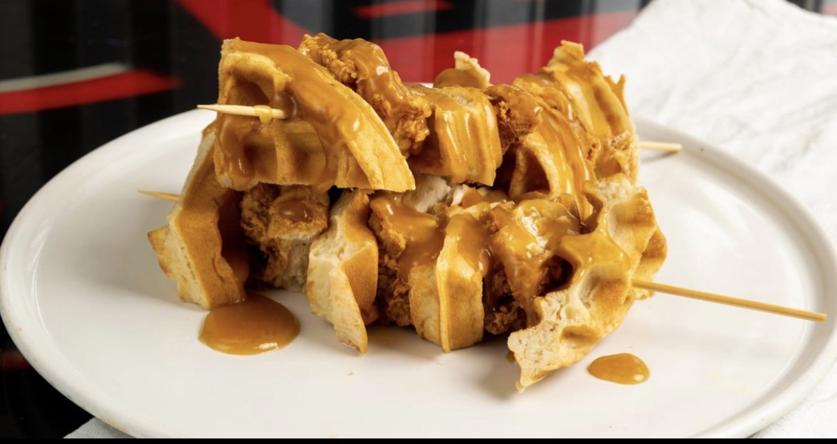 Dirty Bird chicken and waffle skewers drizzled with sauce